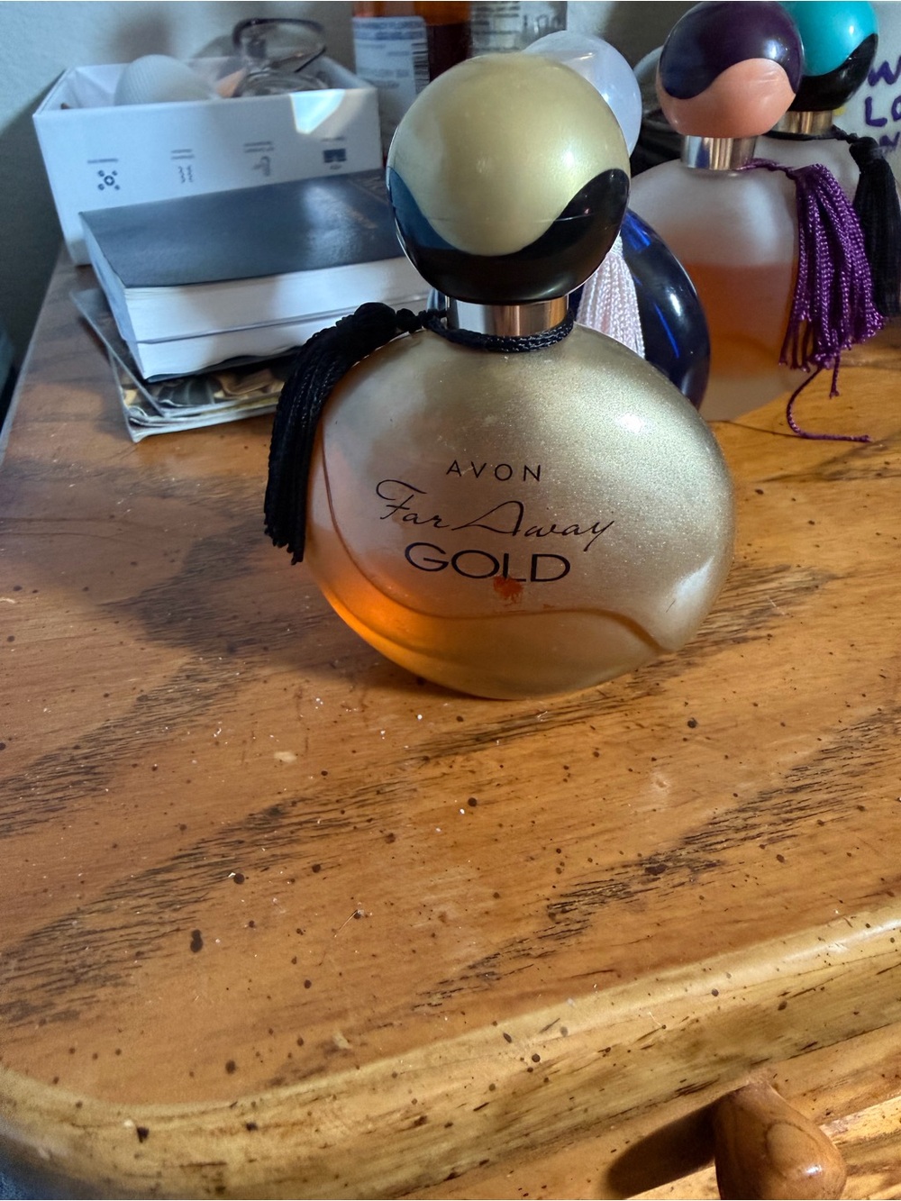 Avon Gold Decorative Home Accent Bottle with Black Tassel with perfume